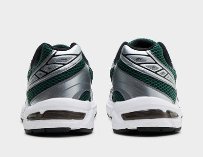ASICS GEL-1130. Rear view of pair of running shoes showing evergreen mesh heels, metallic silver overlays, black collar lining, and visible GEL technology window in the white midsole. 