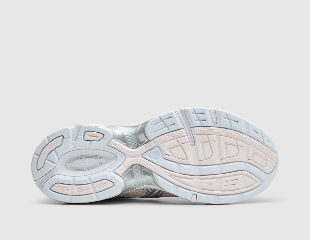ASICS GEL-1130. Bottom view of single shoe showing light grey rubber outsole with blush pink tread pods, flex grooves, and midfoot TRUSSTIC support plate. 
