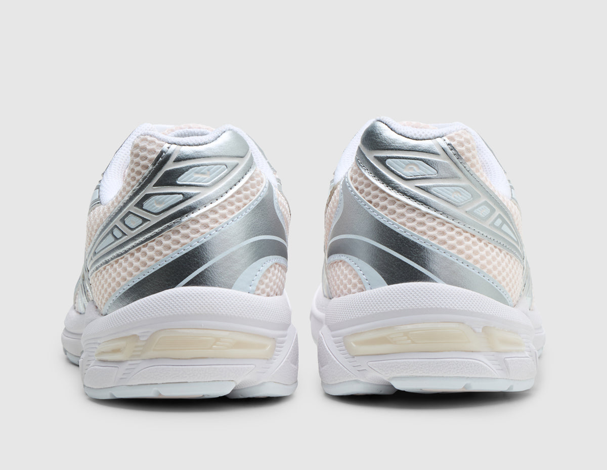 ASICS GEL-1130. Rear view of pair of running shoes showing blush pink mesh heels, metallic silver overlays, white collar lining, and GEL tech midsole inserts. 