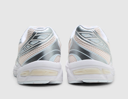 ASICS GEL-1130. Rear view of pair of running shoes showing blush pink mesh heels, metallic silver overlays, white collar lining, and GEL tech midsole inserts. 