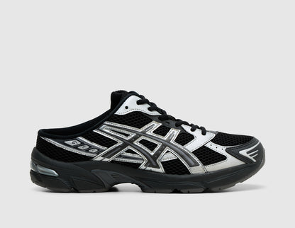 ASICS GEL-1130 Mule. Side view of black mesh backless mules featuring metallic graphite grey synthetic overlays, and GEL cushioned sole. 