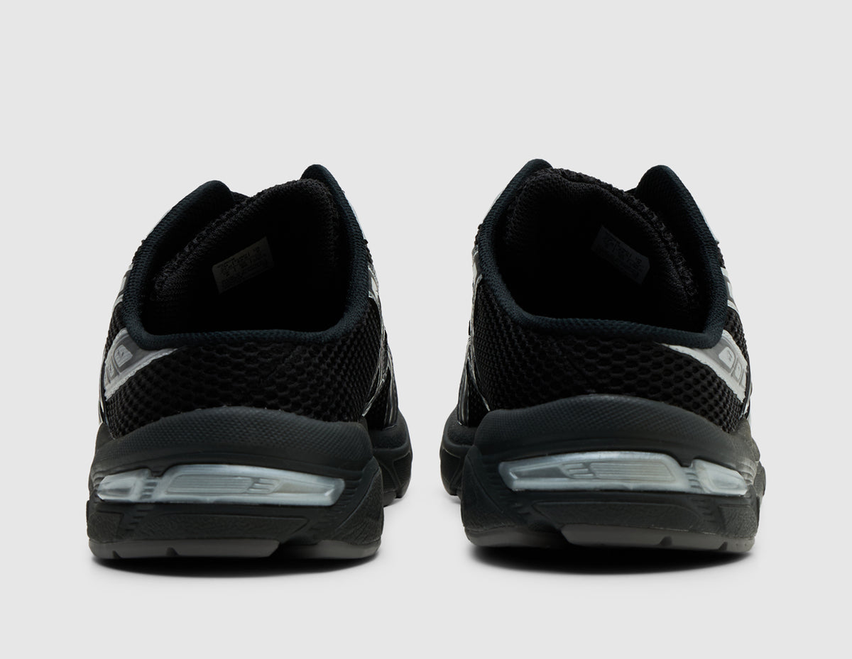 ASICS GEL-1130 Mule. Rear view of pair of black backless mules showing low backless heel entry and GEL midsole inserts. 