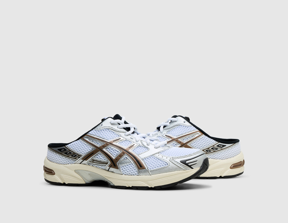 ASICS GEL-1130 Mule. Three-quarter view of pair of white open-back mule sneakers showing clay canyon overlays and white laces. 