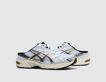 ASICS GEL-1130 Mule. Three-quarter view of pair of white open-back mule sneakers showing clay canyon overlays and white laces. 