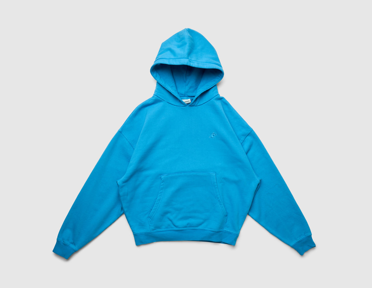 Home Grown Brutal HD Hoodie. Front view of malibu blue pullover hoodie featuring kangaroo pocket, ribbed cuffs, and hem. 