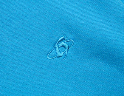 Home Grown Brutal HD Hoodie. Close-up of malibu blue fleece showing tonal embroidered “h” logo on the chest. 