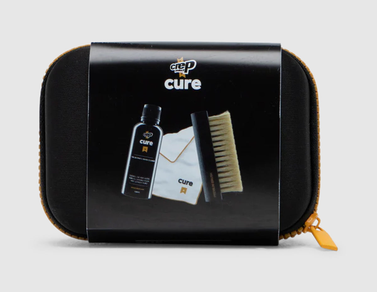 Crep Protect Travel Kit. Front view of black and yellow zipped travel case with branded sleeve packaging. 