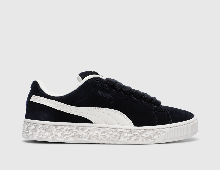 Black and sale white suede pumas