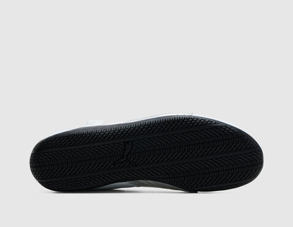 PUMA Women's Speedcat Nova. Bottom view of single PUMA white ballet flat sneaker showing low-profile black tread rubber outsole. 