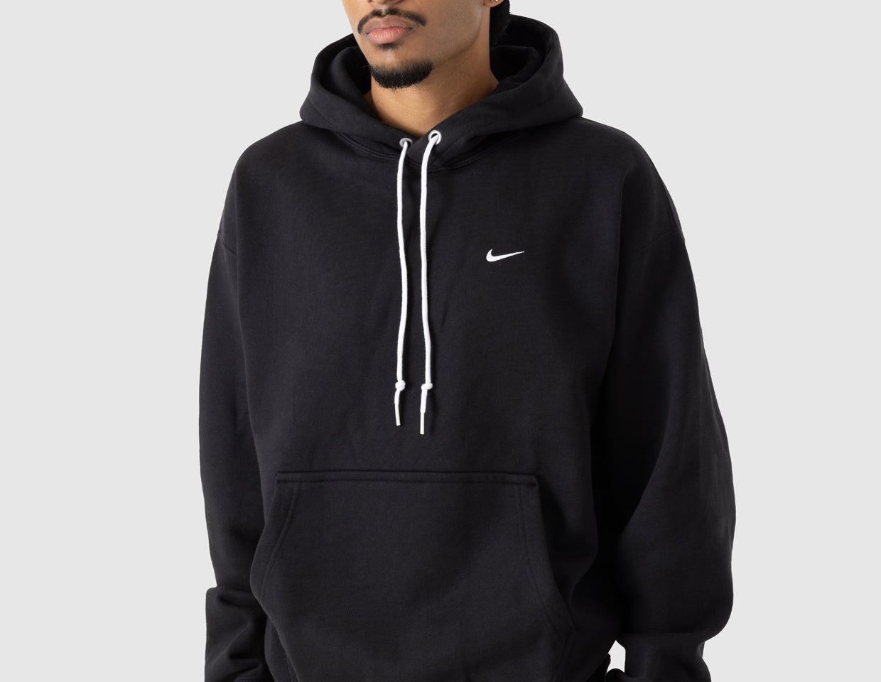 black nike hoodie with white swoosh