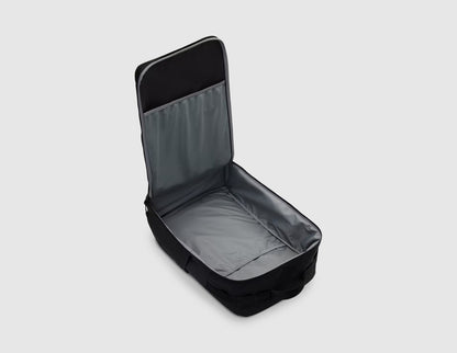 Nike Utility Speed Backpack (27L). Overhead view of main compartment unzipped flat in a clamshell style, displaying spacious grey interior lining and mesh organization sleeves. 
