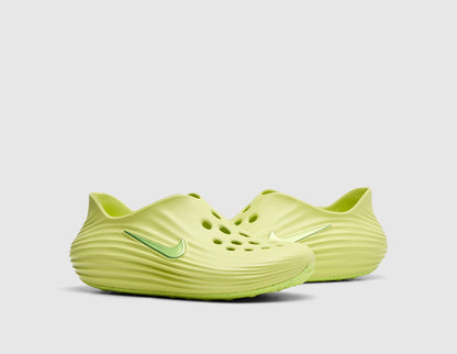 Nike Women's ReactX Rejuven8. Three-quarter view of pair of light lemon twist foam mule slip-on shoes showing sculpted low-cut collar, forefoot ventilation ports, and rounded foam midsoles. 