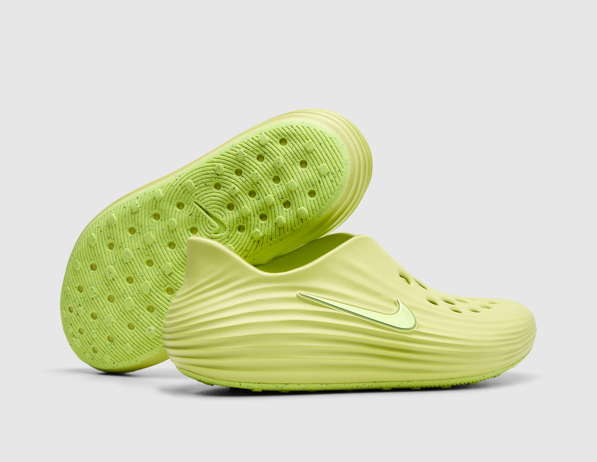Nike Women's ReactX Rejuven8. Side view of stacked light lemon twist foam mule slip-on shoes showing sculpted side ridges and treaded foam outsole design. 