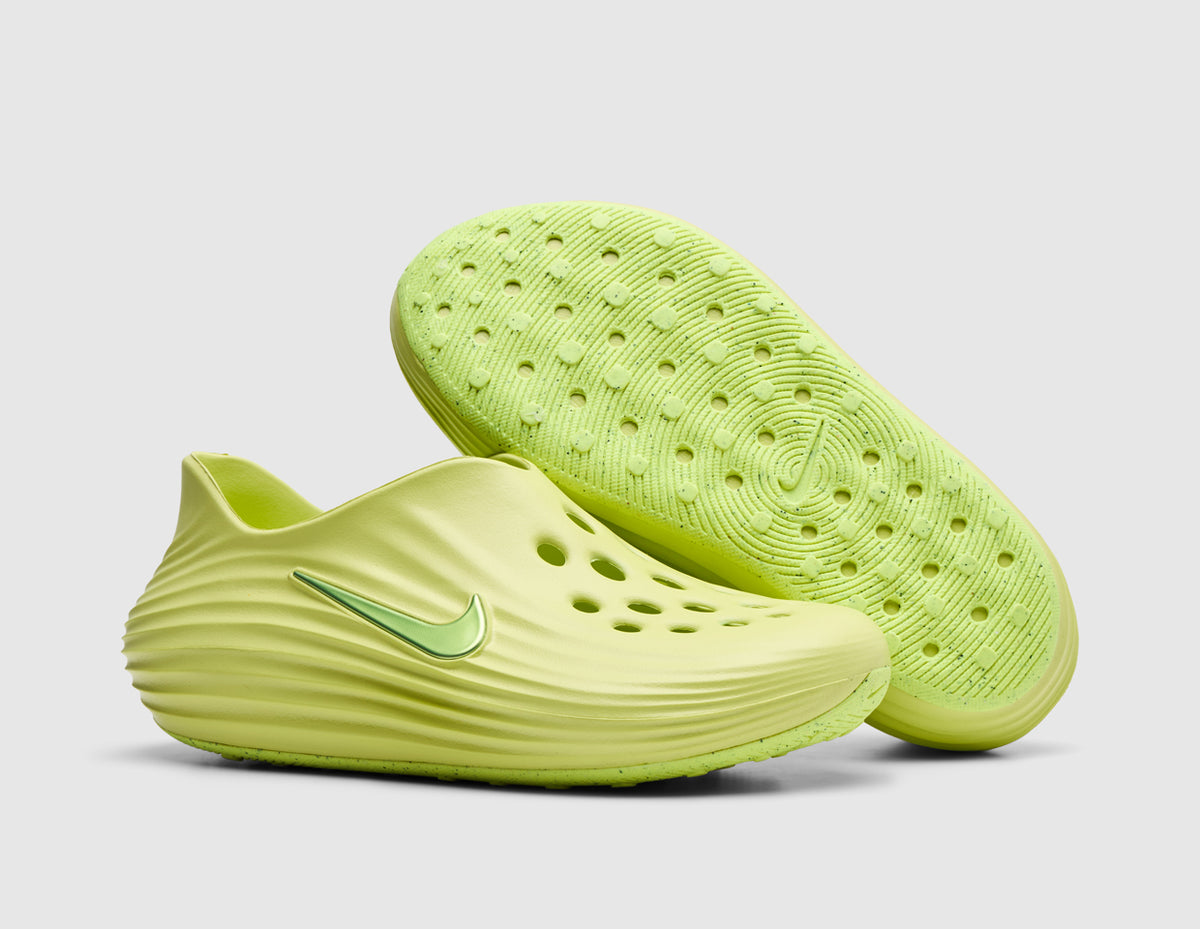 Nike Women's ReactX Rejuven8. Three-quarter view of light lemon twist foam mule slip-on shoes with one shoe propped to showcase the treaded foam outsole pattern. 