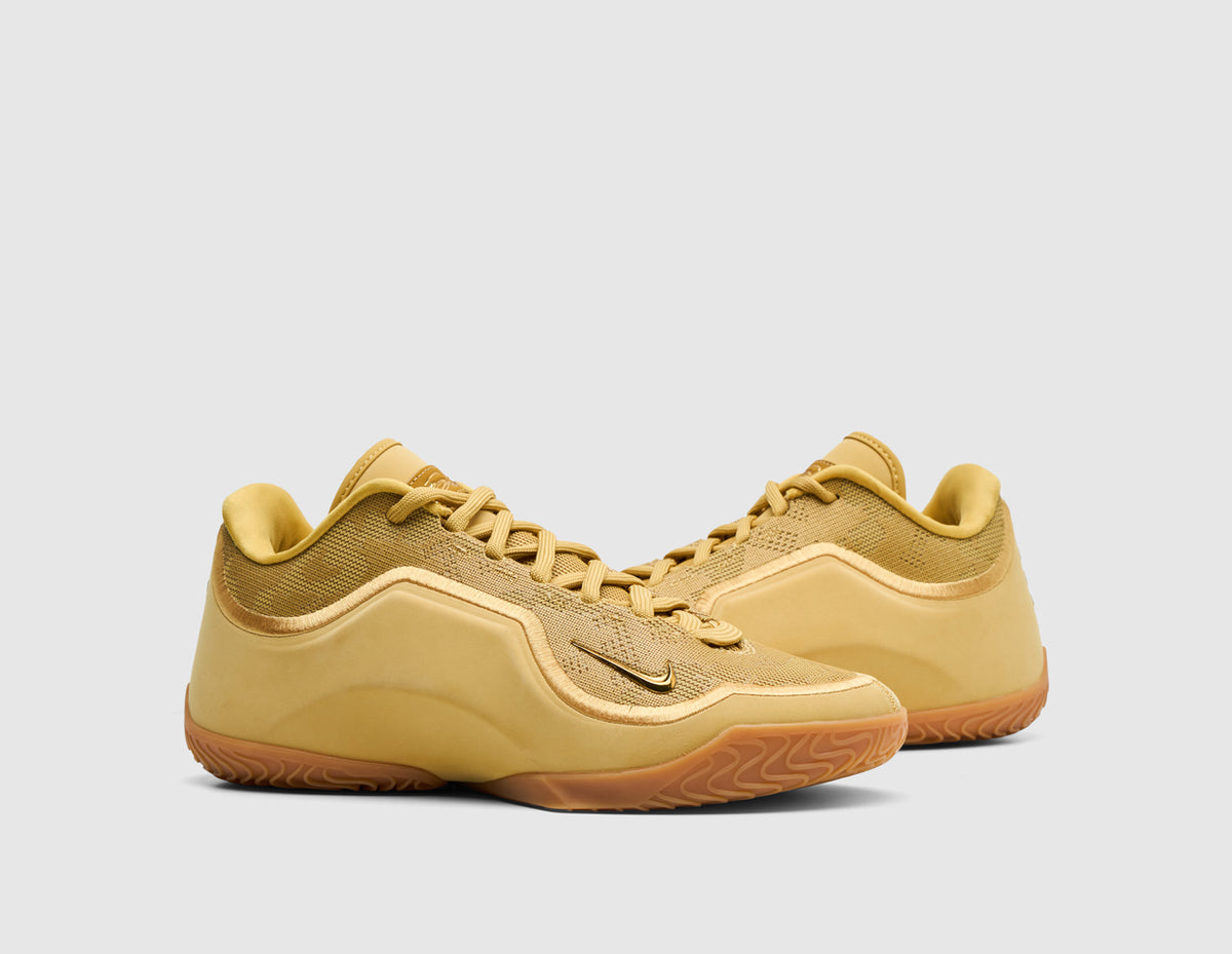 Nike LeBron XXIII "Honor Society". Three-quarter view of wheat gold basketball shoes showing mesh knit upper and matching laces. 
