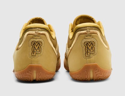 Nike LeBron XXIII "Honor Society". Rear view of wheat gold basketball shoes showing MVP graphic heel emblems and gum outsoles. 