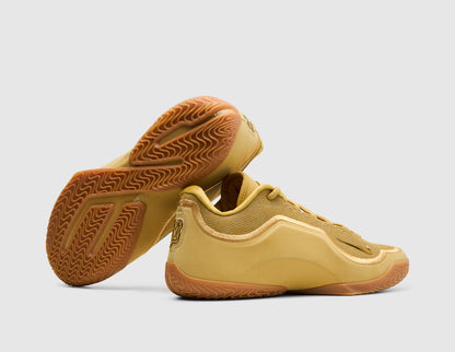 Nike LeBron XXIII "Honor Society". Side view of stacked wheat gold basketball shoes showing gum rubber traction outsole pattern. 