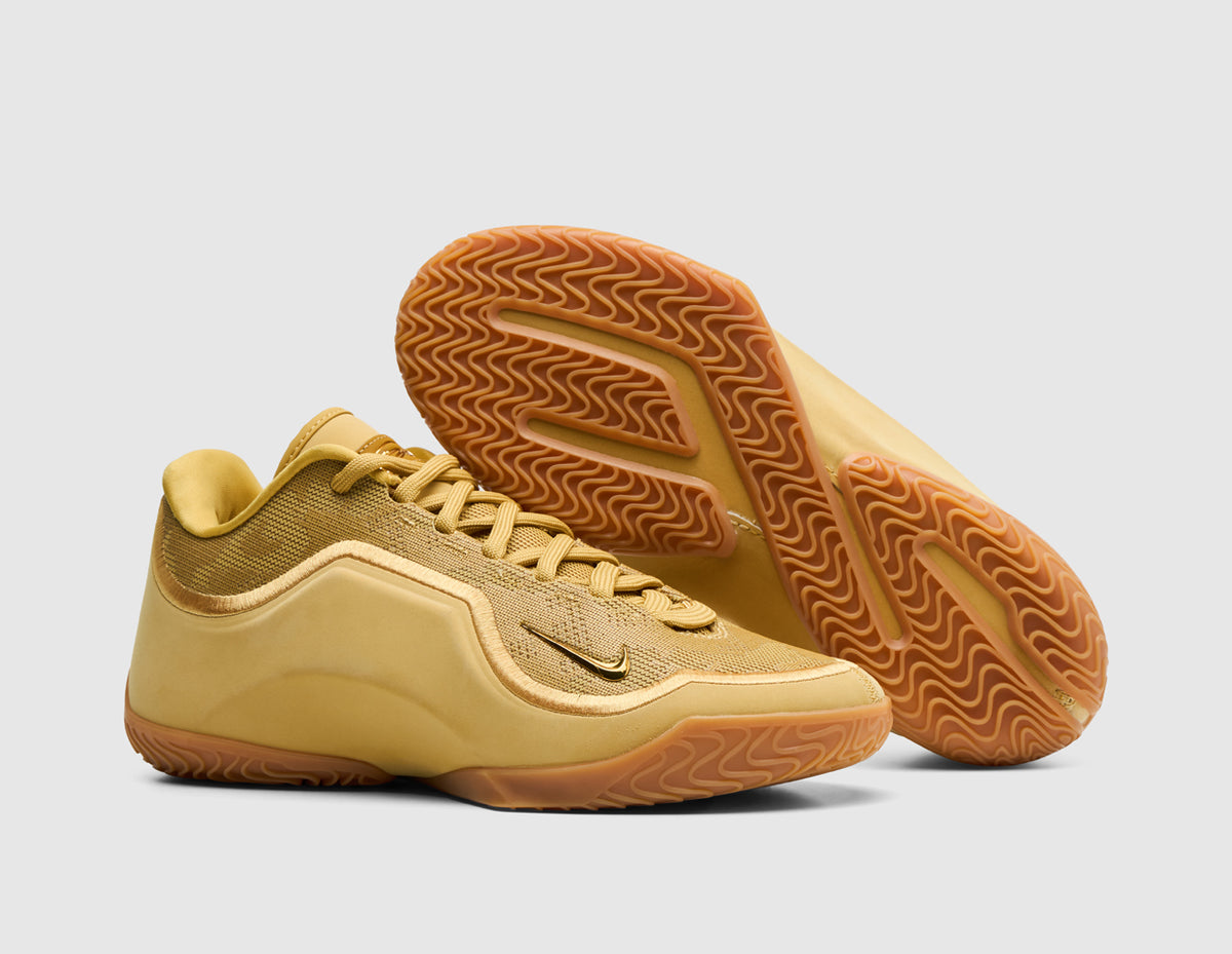 Nike LeBron XXIII "Honor Society". Three-quarter view of wheat gold basketball shoes with one shoe turned to showcase the gum outsole. 