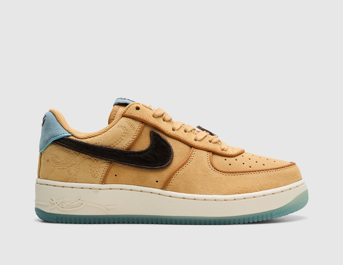 Nike Kobe Air Force 1 Low Protro. Side view of low-top sneakers featuring a twine and flax suede upper with exposed stitching, baroque brown suede side Swoosh, light blue heel tab, off-white stitched midsole, and semi-translucent light blue outsole. 