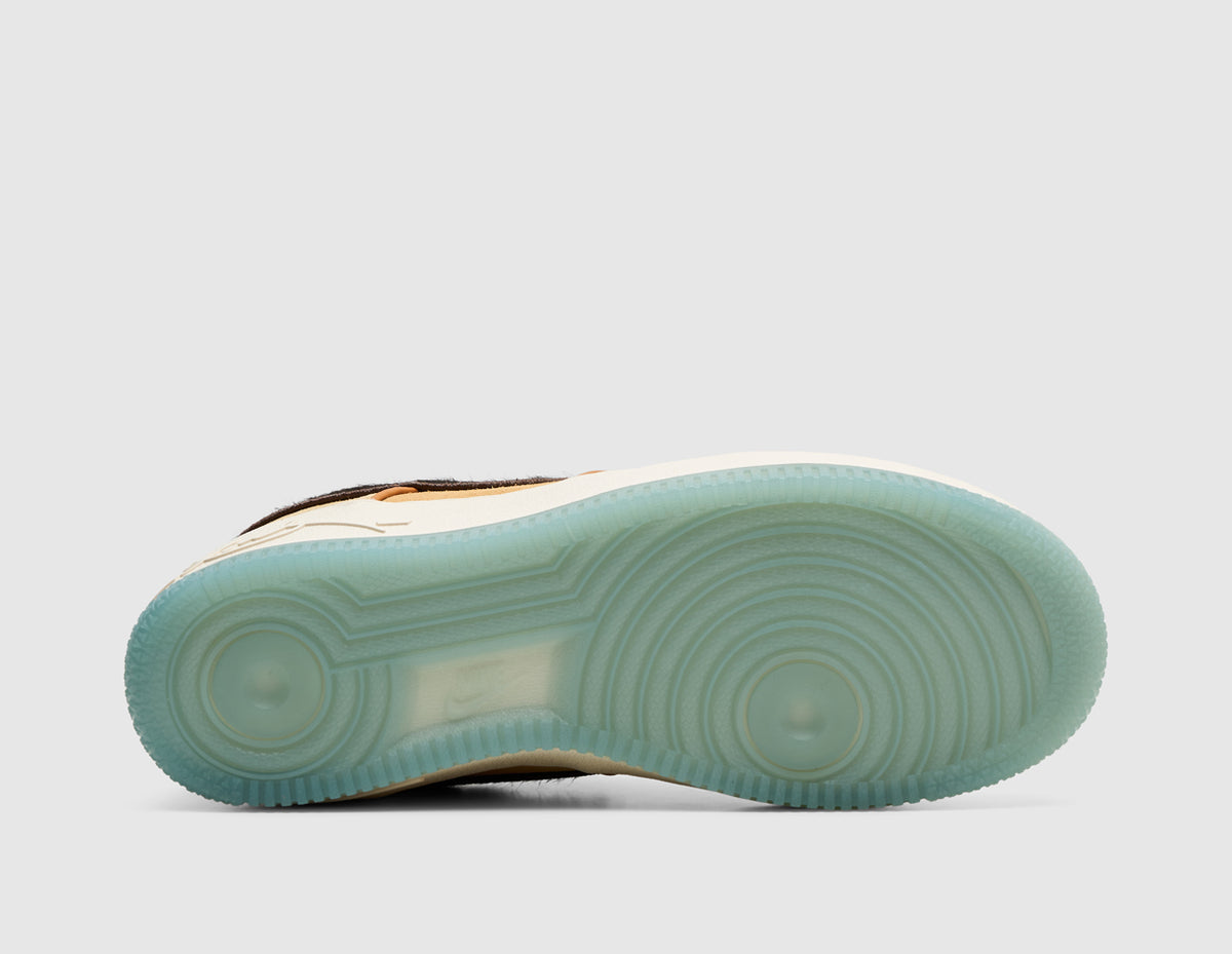 Nike Kobe Air Force 1 Low Protro. Bottom view of single shoe showing semi-translucent light blue rubber outsole with classic Air Force 1 circular pivot-point traction pattern. 