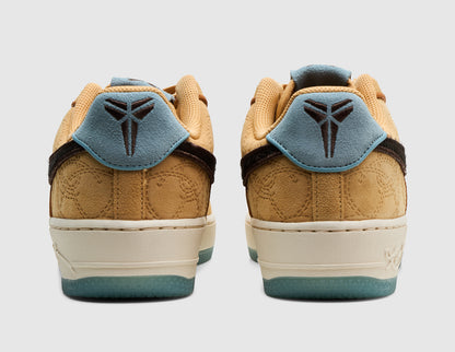 Nike Kobe Air Force 1 Low Protro. Rear view of pair of low-top sneakers showing twine suede heels, light blue suede heel tabs featuring baroque brown embroidered Kobe Sheath logos, off-white midsoles, and semi-translucent blue outsoles. 