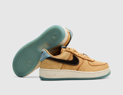 Nike Kobe Air Force 1 Low Protro. Dynamic view of pair of sneakers with one shoe resting on its side to display the semi-translucent light blue rubber outsole alongside the twine suede upper and light blue heel tab. 