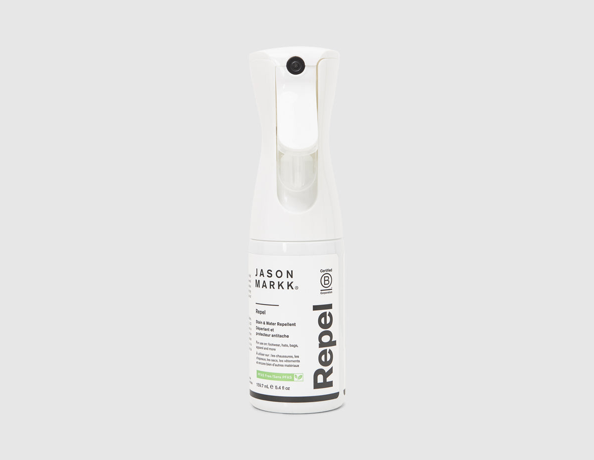 Jason Markk 5.4 oz. Repel Spray. Front view of white shoe stain and water repellent spray bottle with trigger nozzle. 