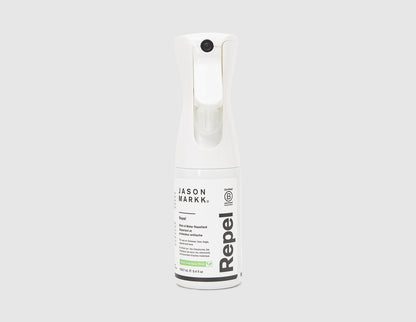 Jason Markk 5.4 oz. Repel Spray. Front view of white shoe stain and water repellent spray bottle with trigger nozzle. 