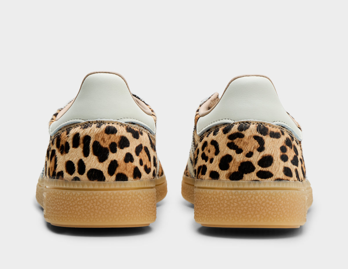 adidas Women's Handball Spezial. Rear view of leopard print sneakers showing white leather heel tabs and gum rubber midsoles. 