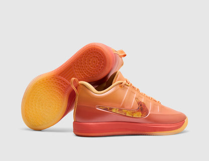 Nike Book 2 "The Phoenix". Side view of stacked sundial orange basketball shoes showing flame-graphic side Swoosh and translucent gum traction outsole.