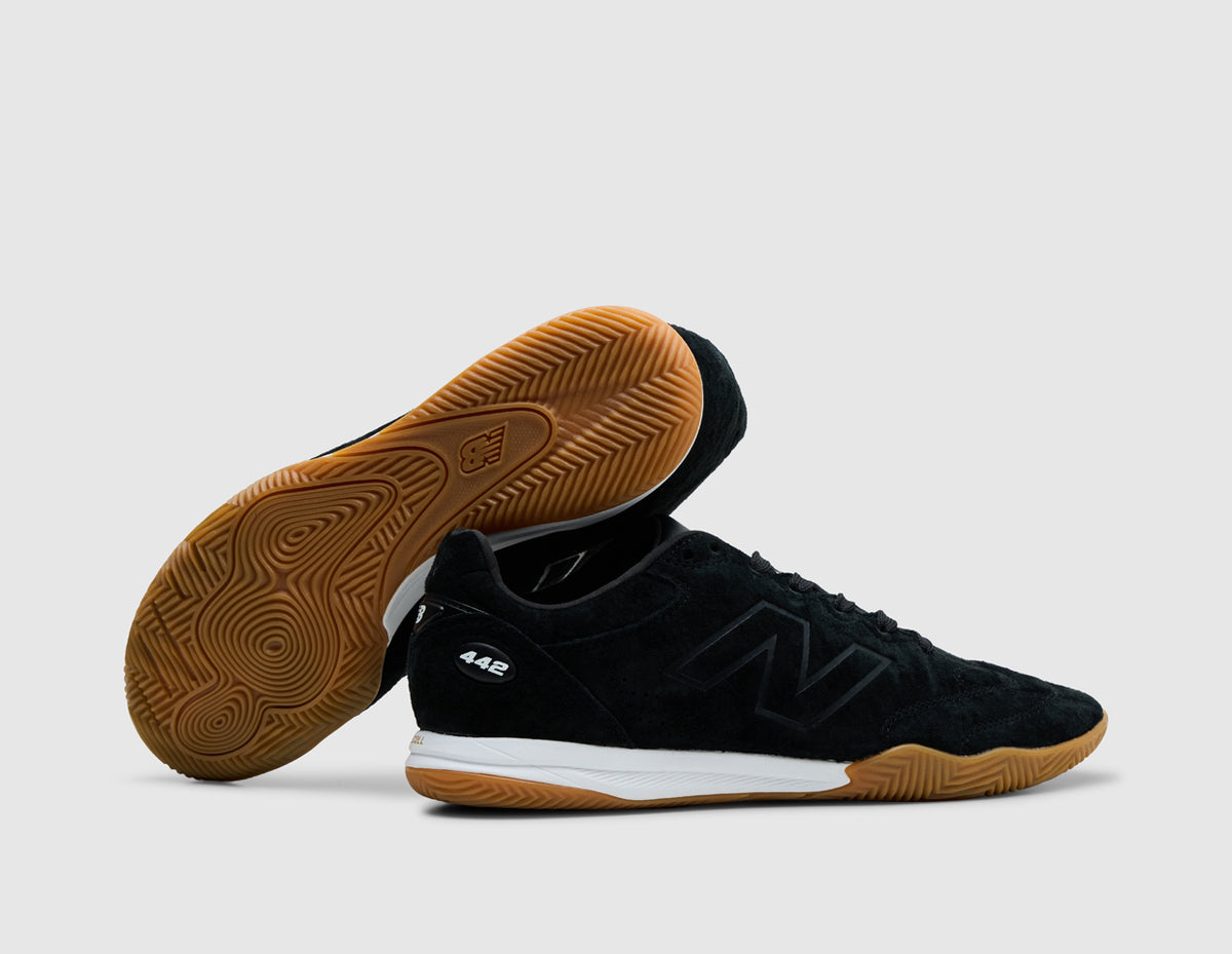 New Balance 442 Elite IN LS V3. Side view of stacked sneakers showing white midsole and gum rubber outsole design. 