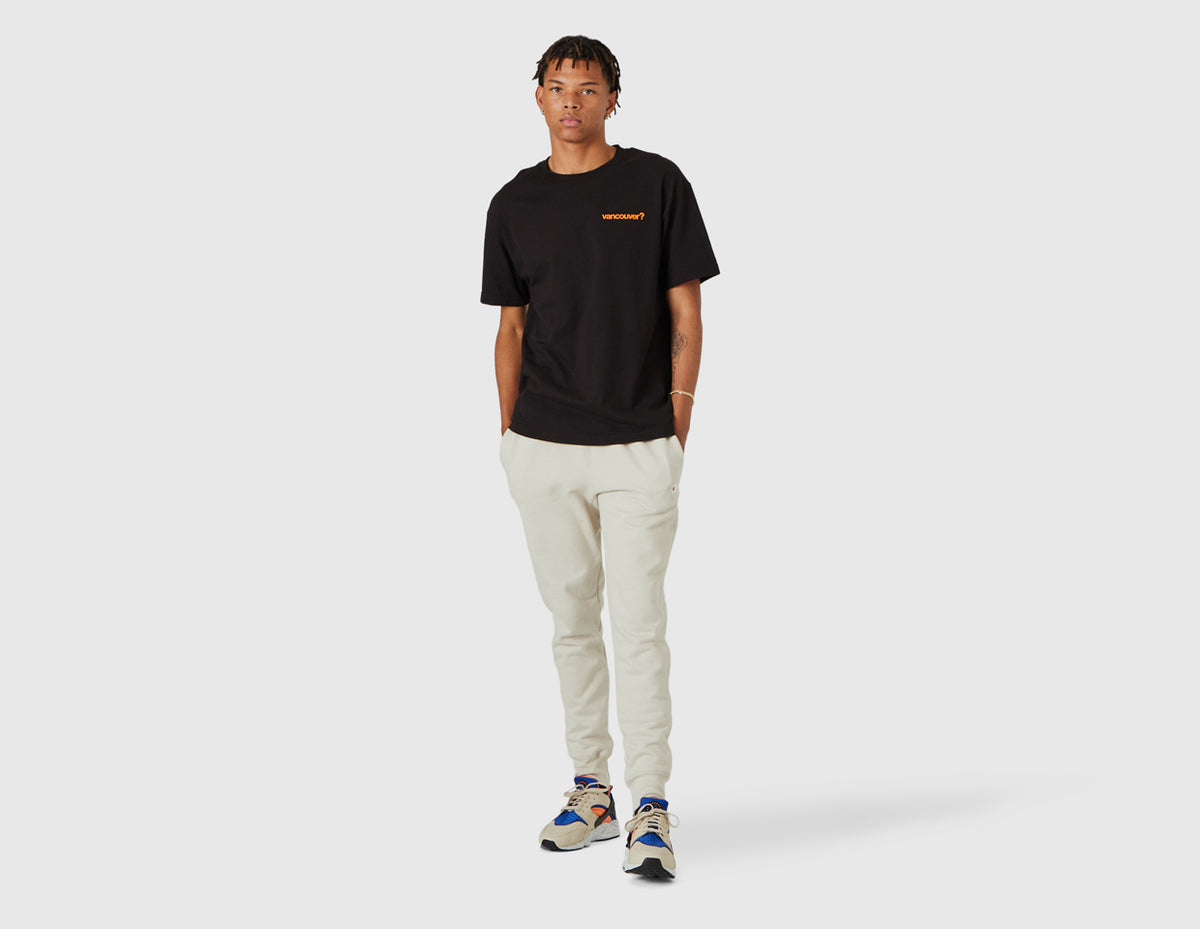 size? Vancouver Logo T-Shirt. Full-length model view of male model styled in the black shortsleeve t-shirt. 