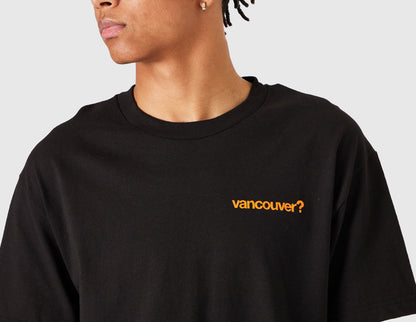size? Vancouver Logo T-Shirt. Close-up model view of male model showing orange printed "vancouver?" logo on left chest and ribbed crewneck collar. 