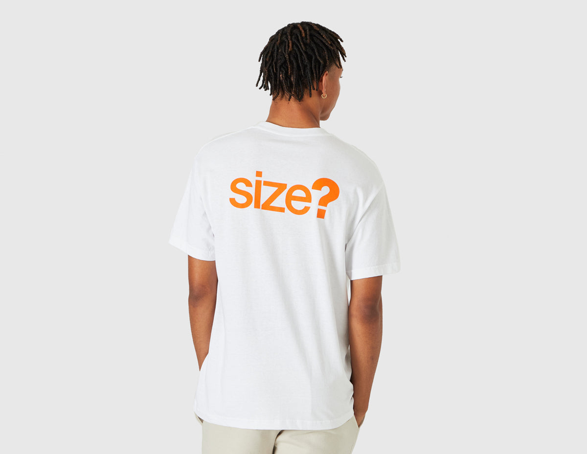 size? Vancouver Logo T-Shirt. Rear model view showing male model in white t-shirt featuring large orange printed "size?" graphic across the back shoulders. 