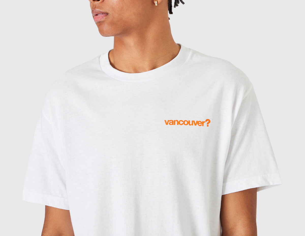 size? Vancouver Logo T-Shirt. Close-up model view of male model showing orange printed "vancouver?" logo on left chest and ribbed crewneck collar. 